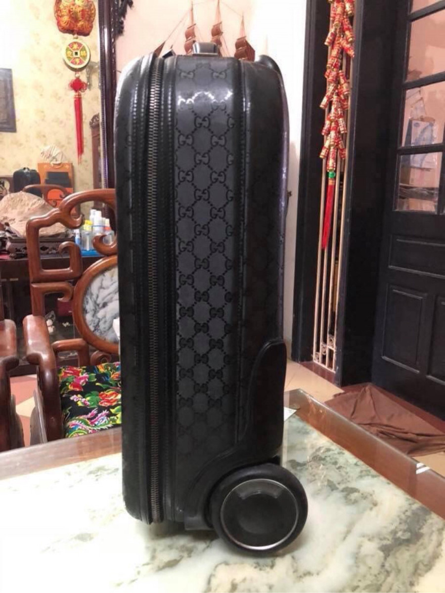 Gucci black interlocking GG suitcase