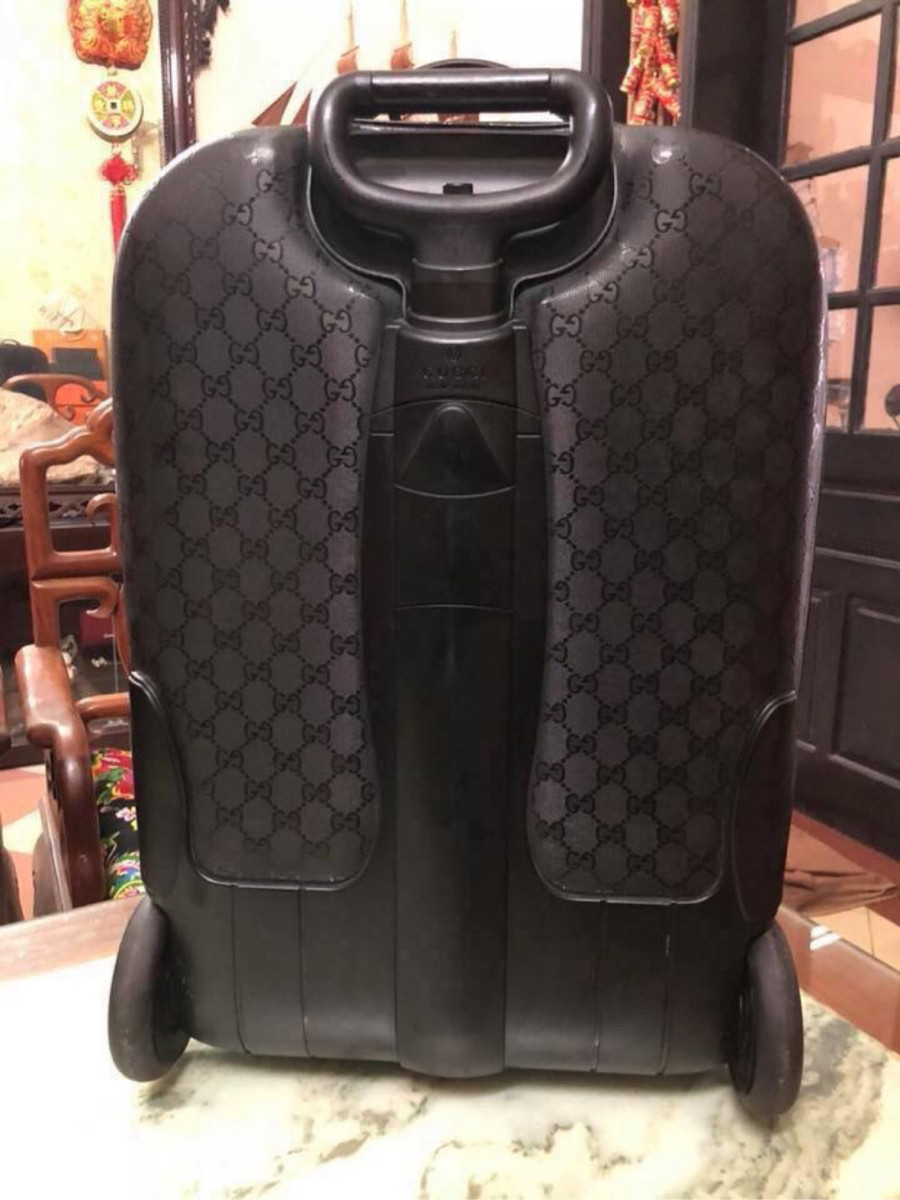 Gucci black interlocking GG suitcase