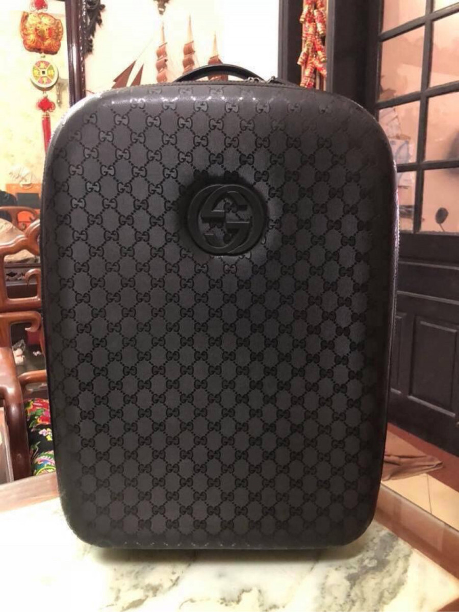 Gucci black interlocking GG suitcase