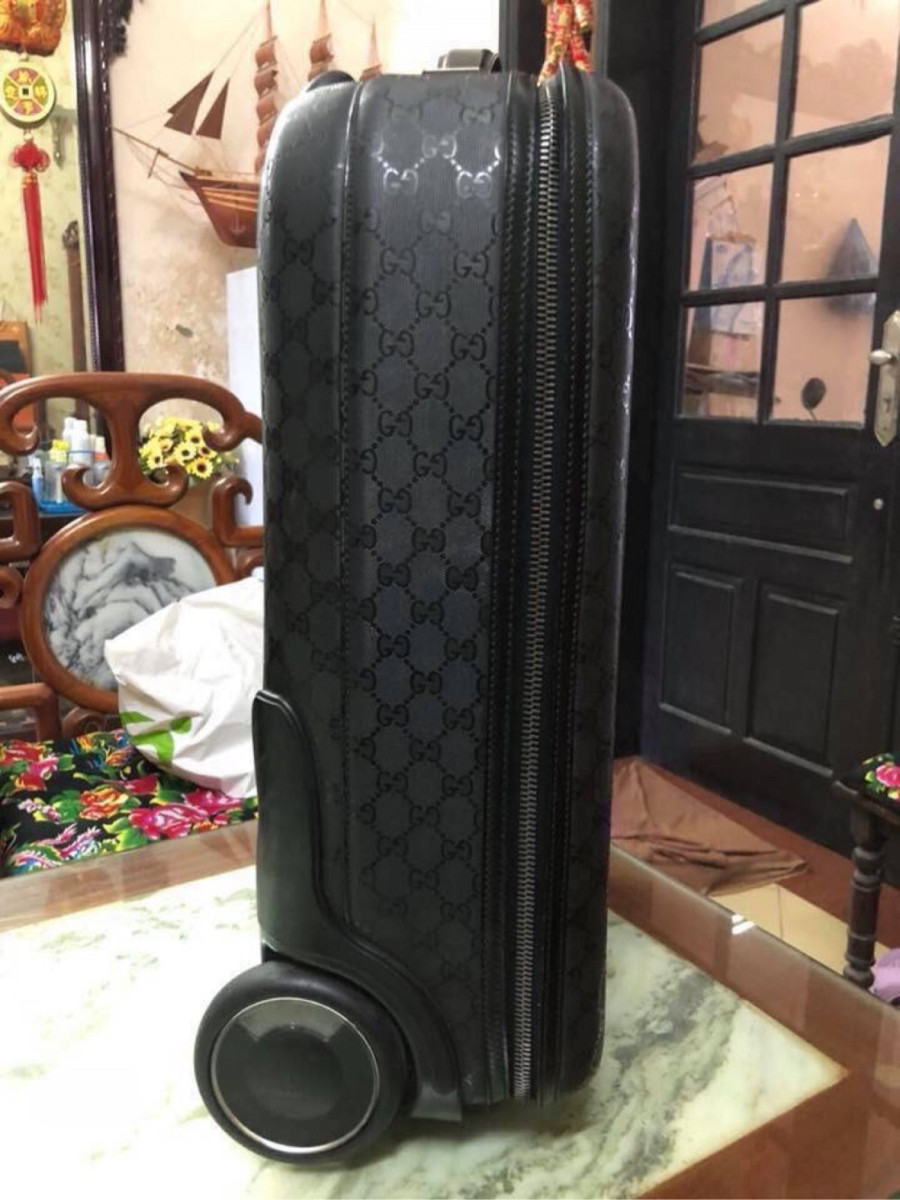 Gucci black interlocking GG suitcase