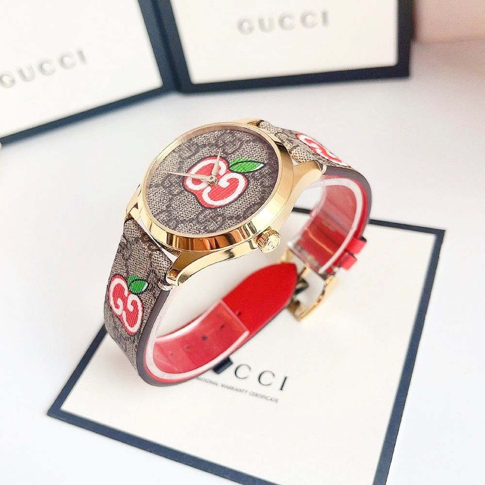 Đồng hồ Gucci G-Timeless Apple Canvas Dial Leather Ladies Watch Case 38mm