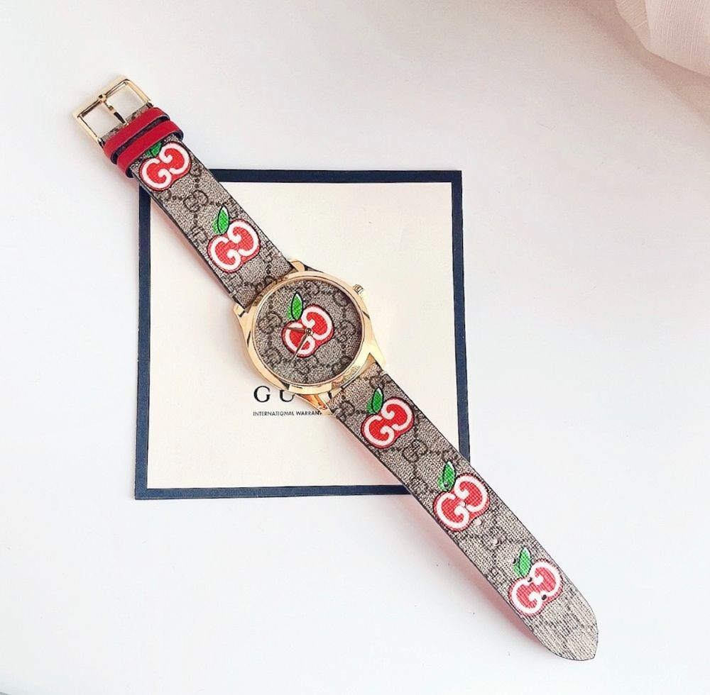 Đồng hồ Gucci G-Timeless Apple Canvas Dial Leather Ladies Watch Case 38mm